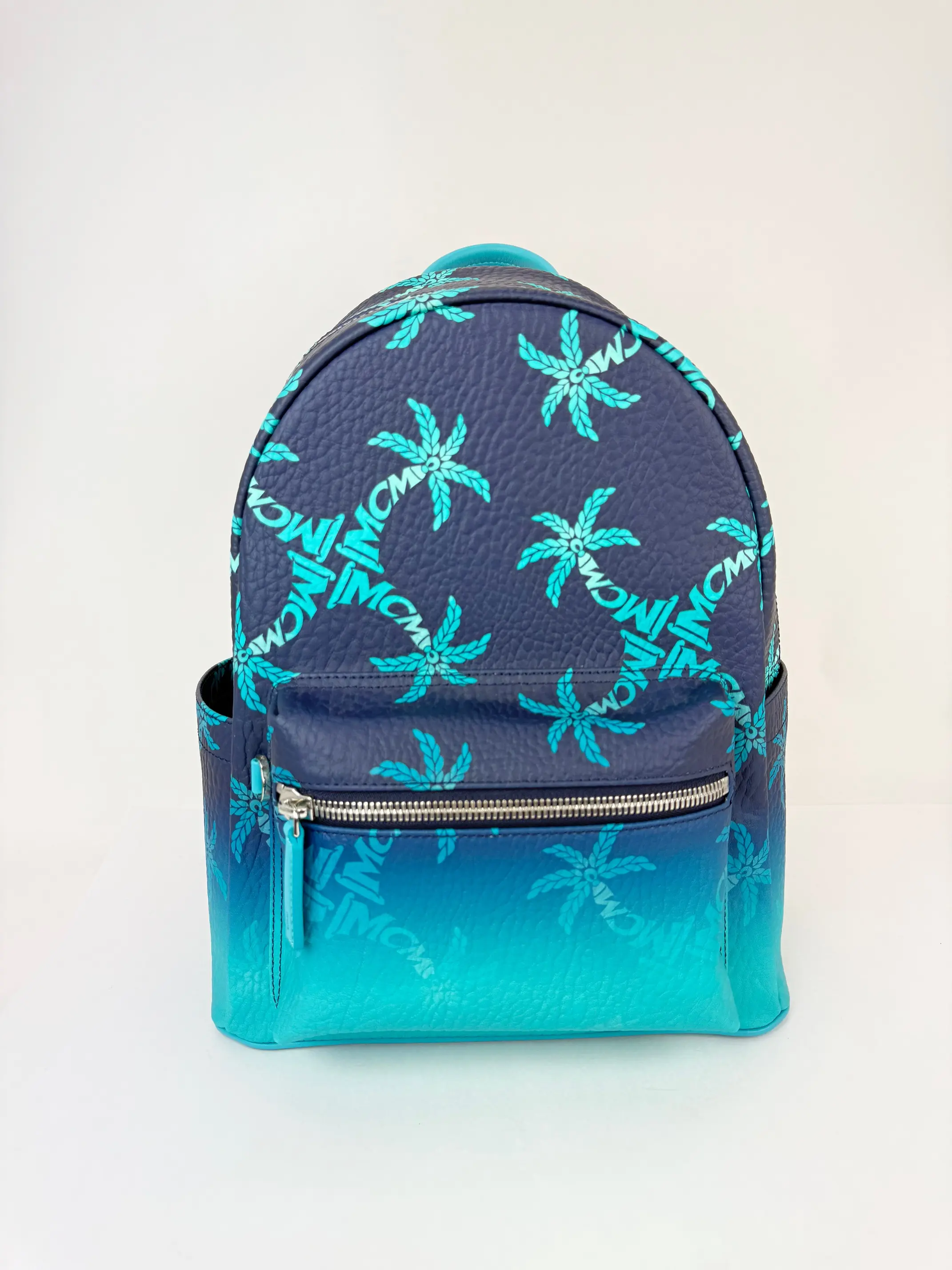 Pre-owned MCM Canvas Backpacks Stark Backpack Ceramic Blue Gradation Palm Design, No New Condition, Silver Accents, Zip Closure, Includes Dust Bag (Pre Loved Luggage & Bag), Adjustable