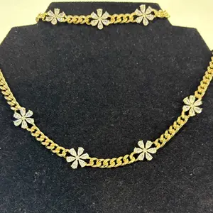 Gold Laminated Chain with Flower Accents for Stylish Outfits cuban link