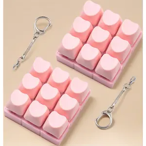 a stress relief fidget toy for office anxiety and ASMR this 2 pcs set of keyboard fidget toy for adult features pink heart shaped keyboard clicker keychain in a cute design