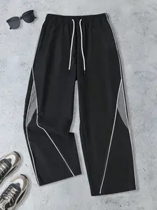 Unisex design. Men’s baggy wide-leg sweatpants featuring color blocking and side stripes; elastic drawstring waist, casual street style long pants. Soft, breathable fabric for comfortable wear; very versatile—perfect for everyday wear and sports.