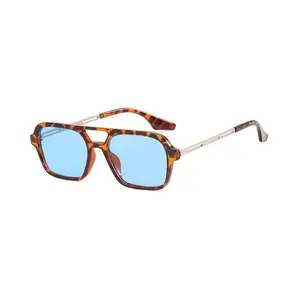A pair of retro double-bridge square sunglasses with hollowed-out frames and clear blue lenses, unisex trendy shades suitable for summer outings, street snaps, vacations, and everyday wear