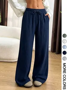 Women’s summer casual long pants made from polyester fiber, featuring a drawstring elastic waistband and a drapey fit; suitable for home and everyday wear. Comfortable, versatile beach pants with side pockets and multiple color options.