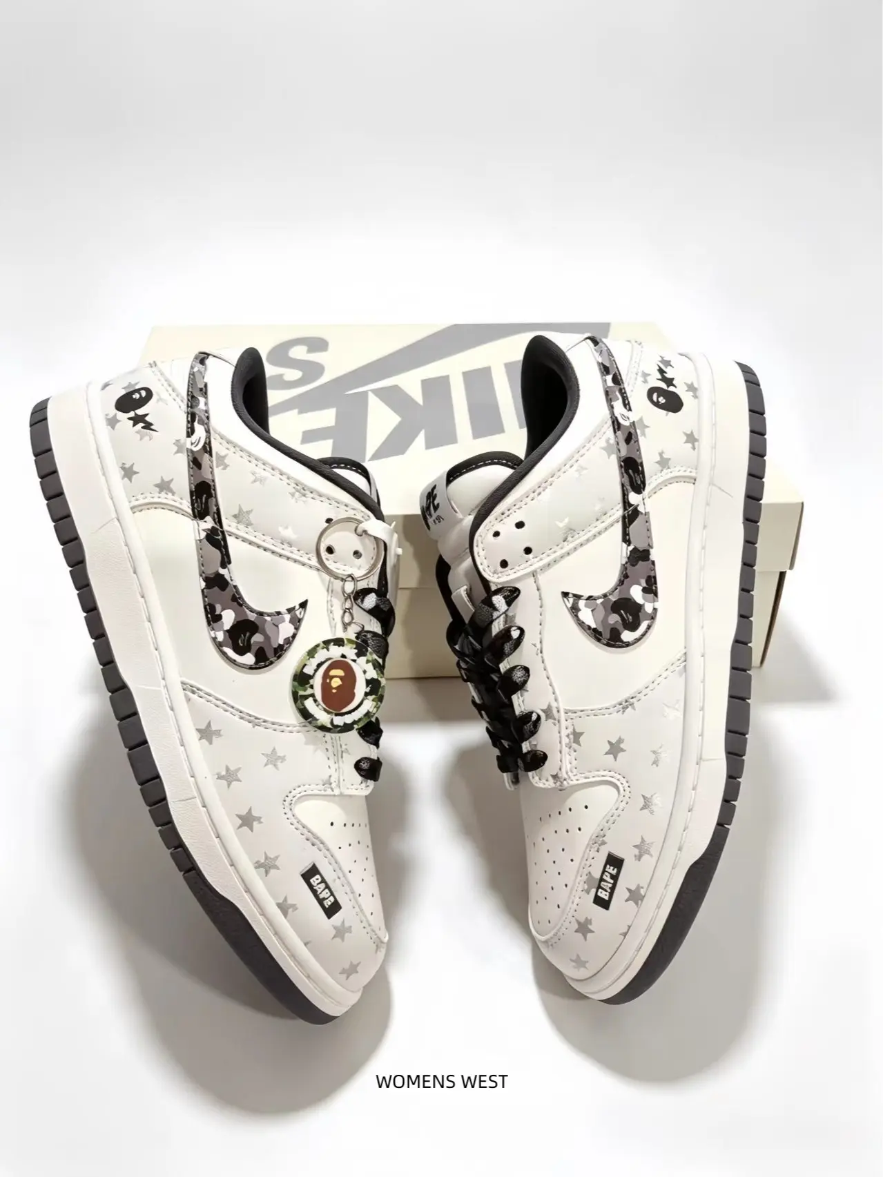 Classic low-top shape combines minimalist white base and scattered printed elements, ideal choice for people who love subtle printed casual street footwear.