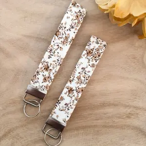 Brown Floral Keychain Wristlet with Floral Pattern and Key Rings for Accessory Use