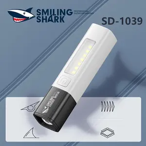 【SD-1039】Smiling Shark multifunctional flashlight, made of ABS material, with a built-in 1200mAh battery, featuring COB side light for flood illumination, and multiple adjustable brightness levels to meet the needs of daily life.