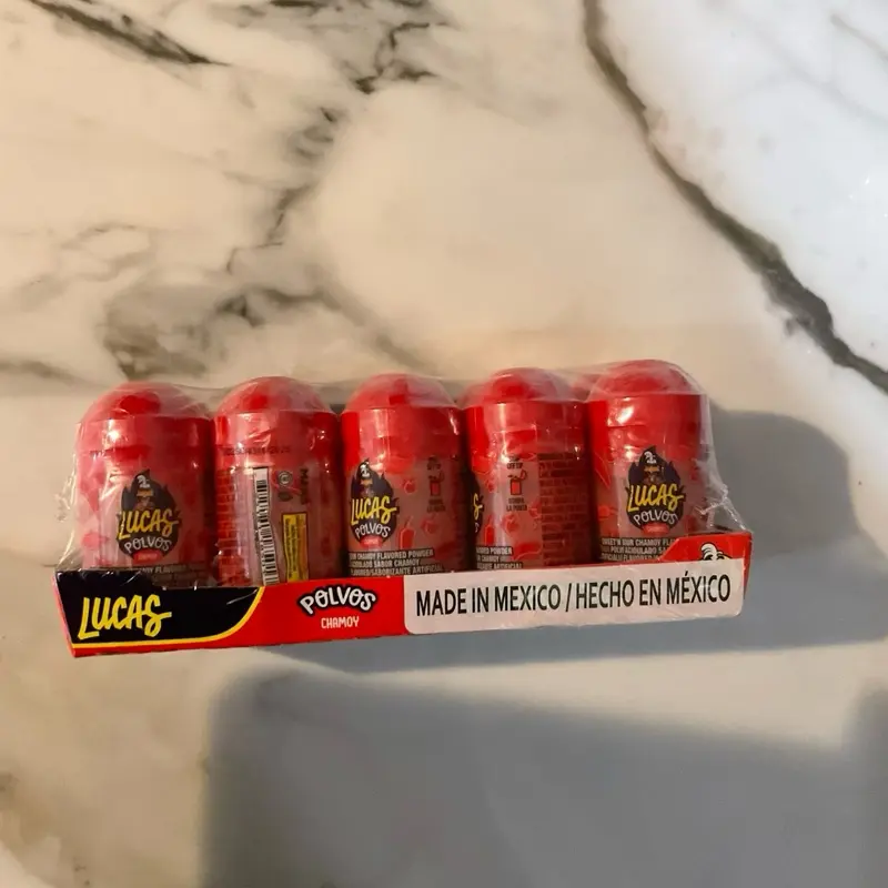 Lucas chamoy   Or mango powdered candy