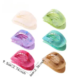 2 random large shark hair clips