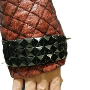 Red Womens Size 7 Battle Jacket with Unique Black Pyramid Detailing on the Sleeve