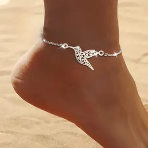 The ankle chain for fashionable women can be worn on the ankle and wrist, featuring a stylish bird shaped hollow decoration design, making it the perfect choice for beach jewelry, bohemian style, retro design, and vacation accessories