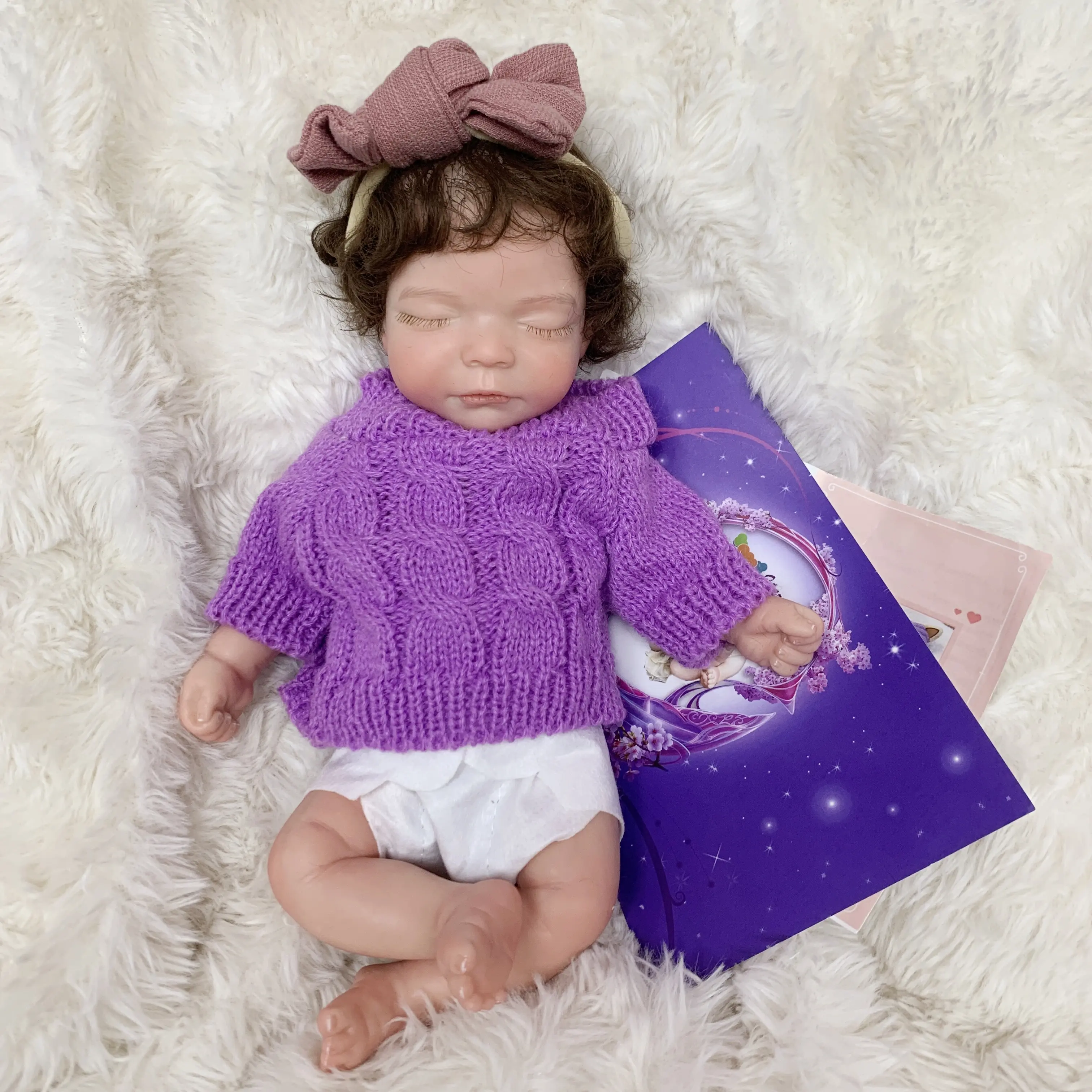 Reborn Baby Doll 10 Inch Full Body Soft Silicone Sleeping Realistic Newborn Girl in Purple Sweater for Collection Festival Birthday Halloween Perfect Christmas Gift for Children Over 3 Years Old