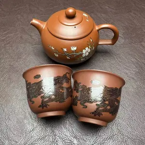 Handcrafted tea pot with plum blossom pattern, comes with matching tea cups.H016