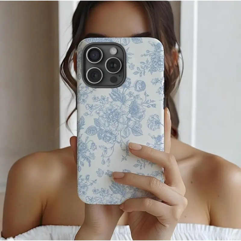 This durable, shock-absorbing, glossy 2-in-1 phone case features a blue floral pattern and is compatible with iPhone 17, 16, 15, 14, 13, 12, 11, X, and Samsung models. It makes a great holiday gift for friends or family.
