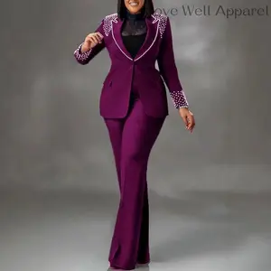 Purple two-piece suit for women — a fashion trend featuring a pearl-embellished blazer and flared trousers. Ideal for stylish outings; basic, chic, and elegant womenswear that can be paired with a raincoat.