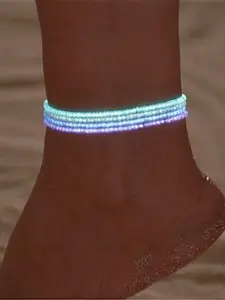 This set of ladies' anklets includes 4 pieces. They are carefully crafted with trendy and unique luminous colored acrylic rice beads and elastic cords. The anklets have the feature of glowing, which can showcase their unique charm at night, Trendy Jewelry