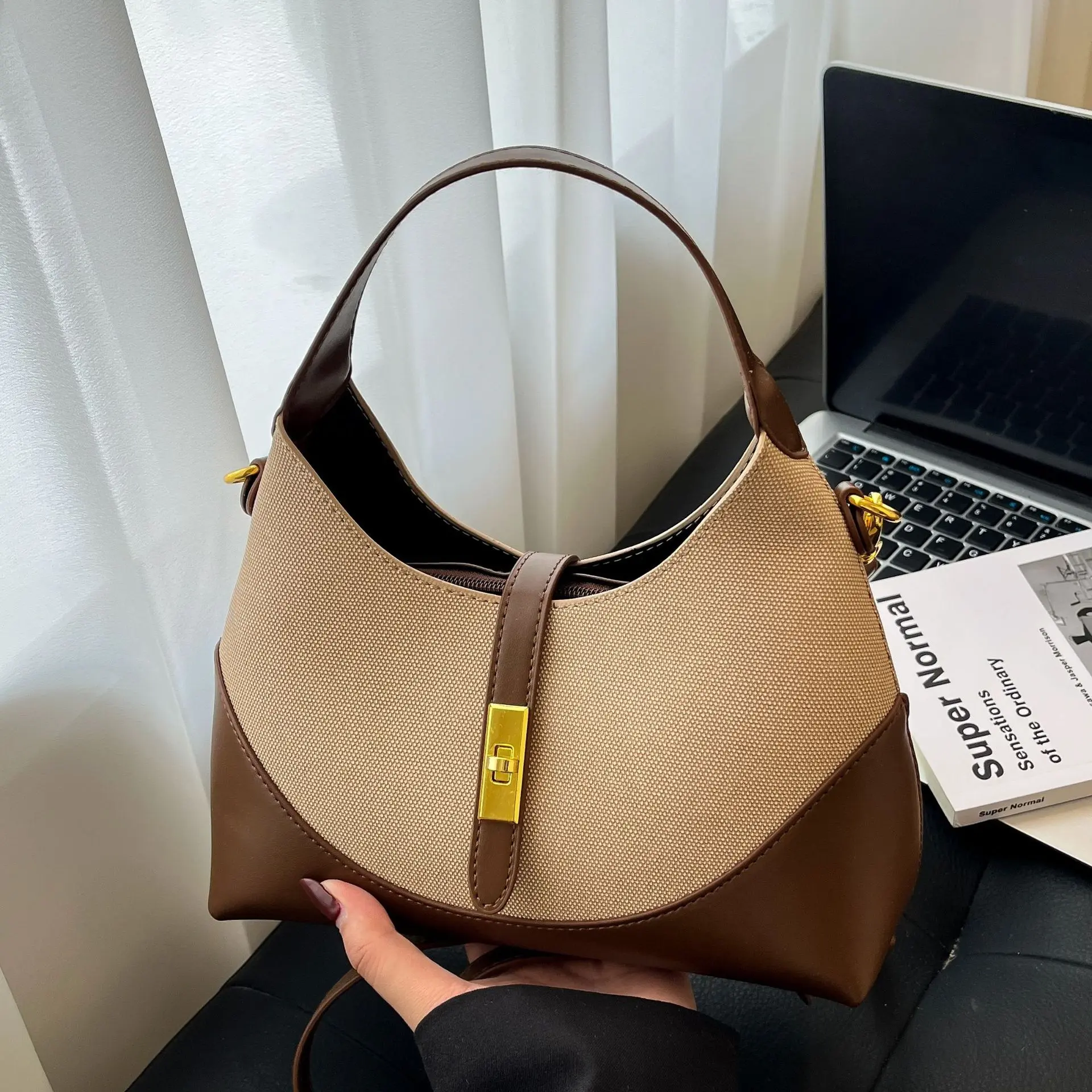 High-end, contrasting color, niche design women's bag, 2026 new model dumpling bag, versatile for commuting, can be used as a handbag, crossbody bag, or underarm bag
