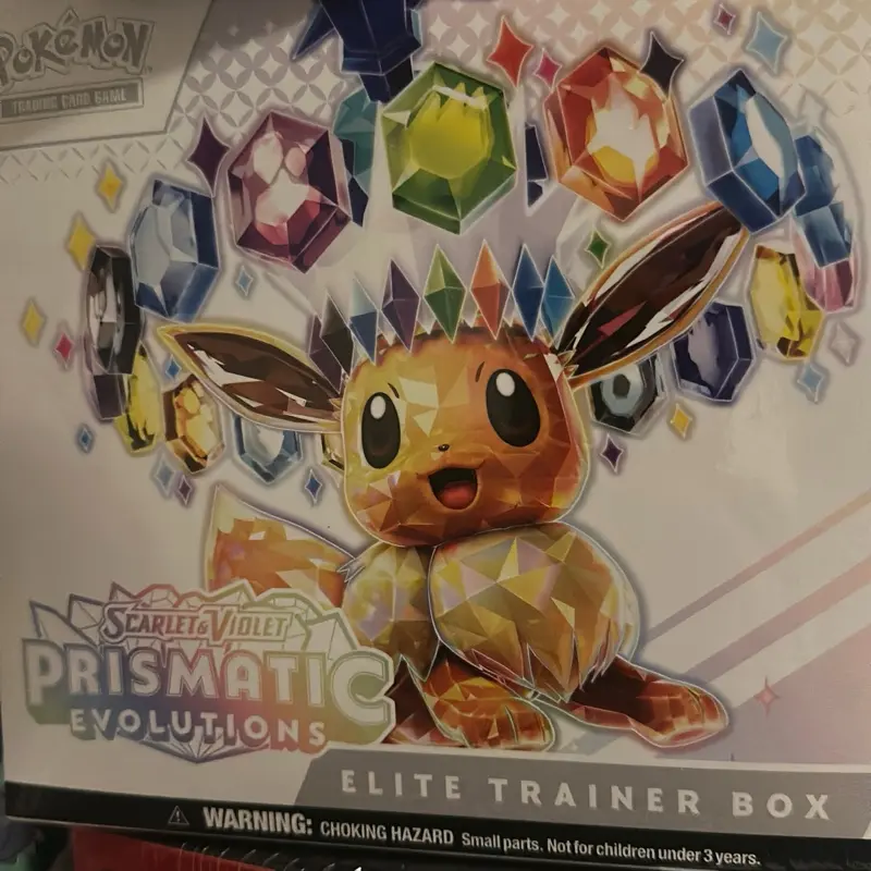 Pokémon TCG: Scarlet & Violet Prismatic Evolutions Elite Trainer Box - Includes 9 Booster Packs, 1 Promo Card, 65 Sleeves, 45 Energy Cards, and More