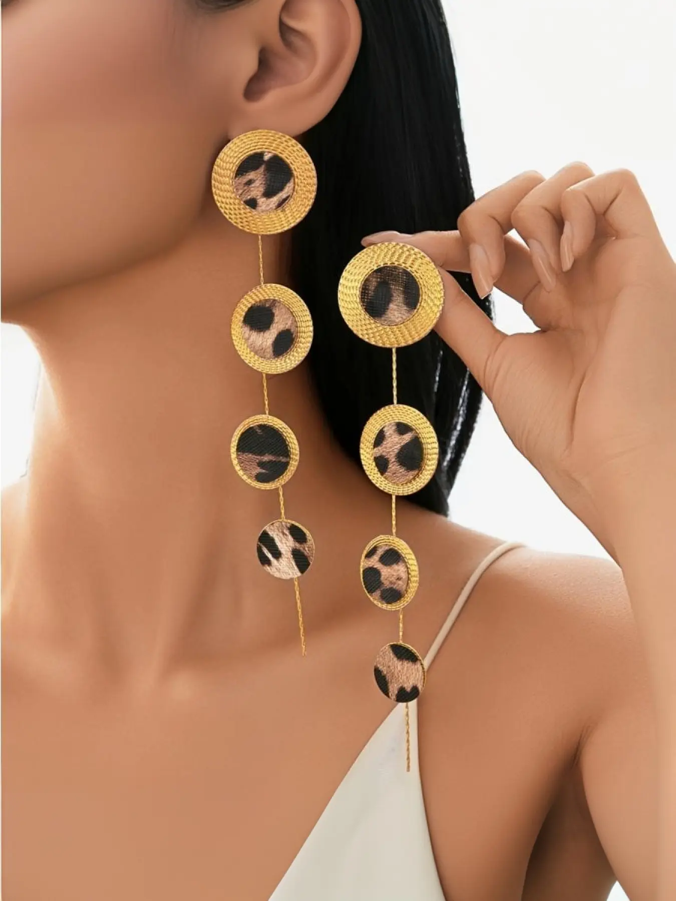 Round leopard print earrings, trendy and stylish, dangle earrings, round disc earrings with tassel design.