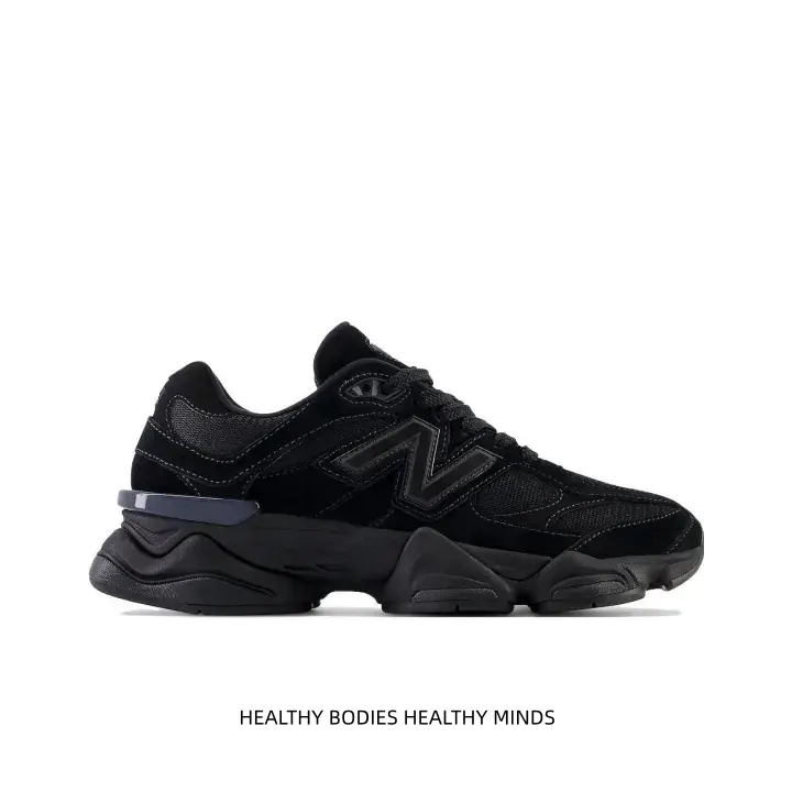 All-black chunky dad sneakers with structured sculpted sole deliver sharp techwear vibe, match black casual shorts & sleeveless top for tough urban dark streetwear