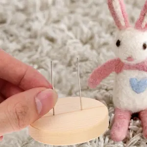 Small wooden base for small doll