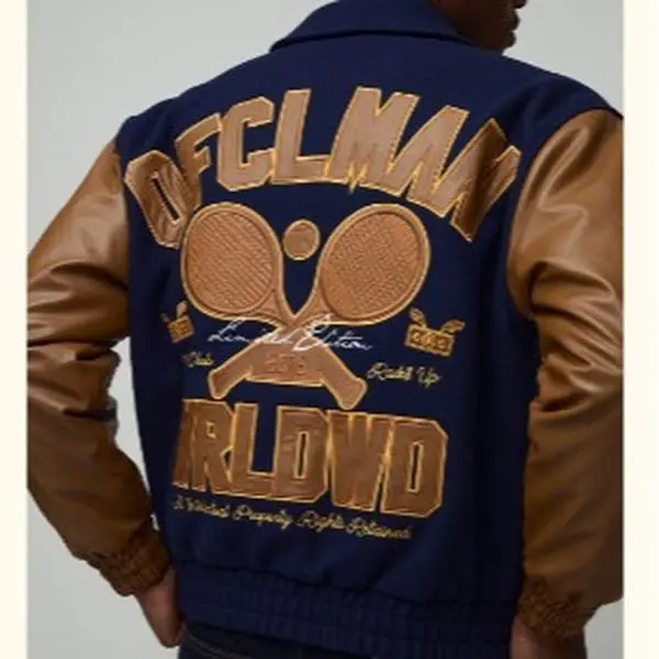 Wimbledon Defclman World Property Right Reserved Navy Blue Tan Jacket with Gold Lettering All Over Print No Additional Details