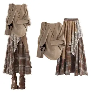 Retro plaid patchwork two-piece set, perfect for a sophisticated winter look. Features a stylish knit top, an asymmetrical skirt, and a flattering silhouette