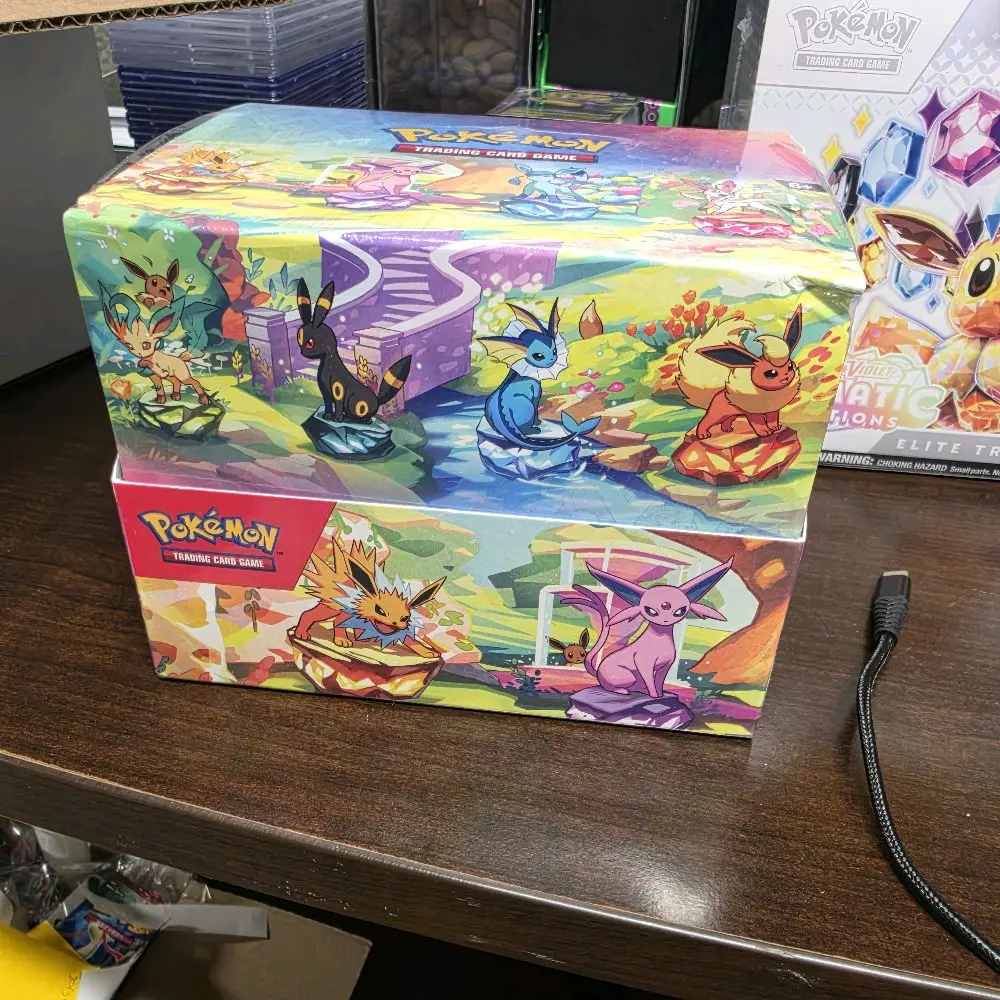 Factory-Sealed Pokémon TCG Scarlet & Violet-Prismatic Evolutions Mini Tin Display - Contains 8 Assorted Mini Tins (Box Has Damage)