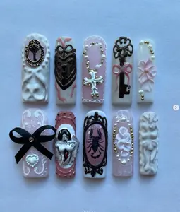 Victorian goth nails with keys, corset bows, cameos & rosaries in soft pinks and whites—elegant, eerie, and baroque to the bone