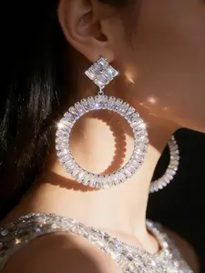 Luxury large circular crystal-inspired earrings, featuring stepped square-cut diamond facets, exuding radiant glamour perfect for red carpets, ideal for galas and weddings