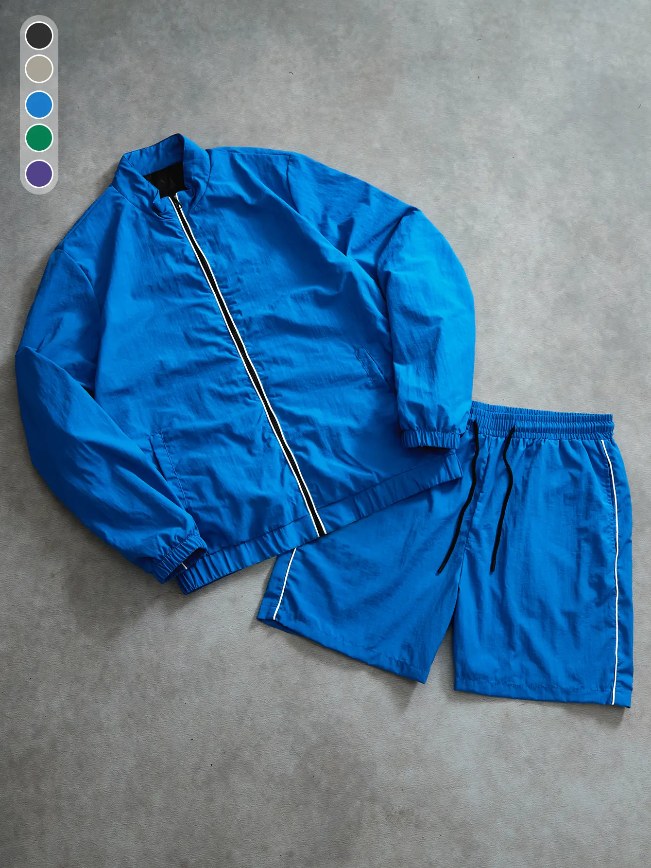 Retro minimalist khaki two-piece athletic set featuring a windproof textured fabric jacket and breathable, moisture-wicking quick-dry shorts. The complete outfit has a relaxed, loose fit suitable for afternoon strolls in the city, casual coffee dates, and