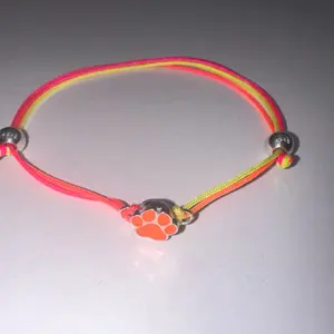 Neon, orange dog, paw charm with multi colored cord bracelet