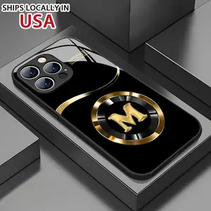 A Tempered Glass Phone Case with a Golden Letter M Design for Iphone Models 16/15/14/13/12/11/XS/XSMAX/PLUS/PROMAX, Which Is Durable, Aesthetically Pleasing, And Visually Appealing. Protection Transparent Astronaut Cover