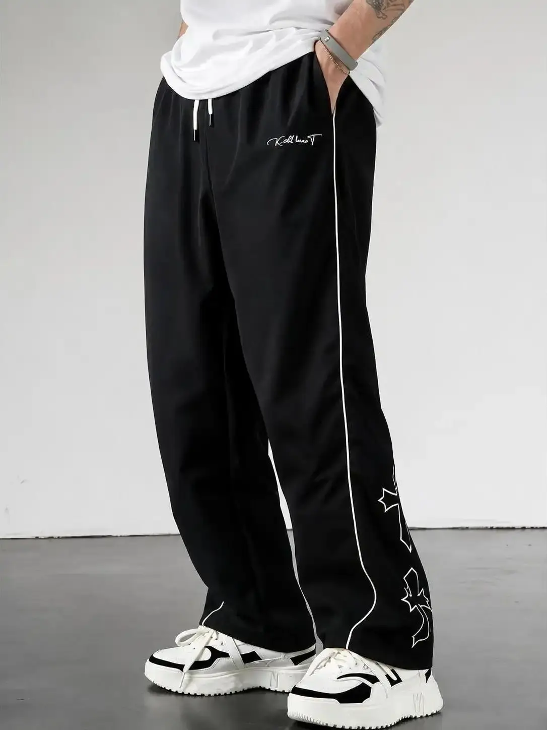 Men's Baggy Polyester Track Pants - Drawstring, Contrast Side Piping, Script Embroidery, Gothic Cross Outline Graphic, Below Ankle, Relaxed Slouchy Fit, All Seasons, Machine Washable Y2K Streetwear Joggers Elastic Print Menswear Loose Stripe Sneakers