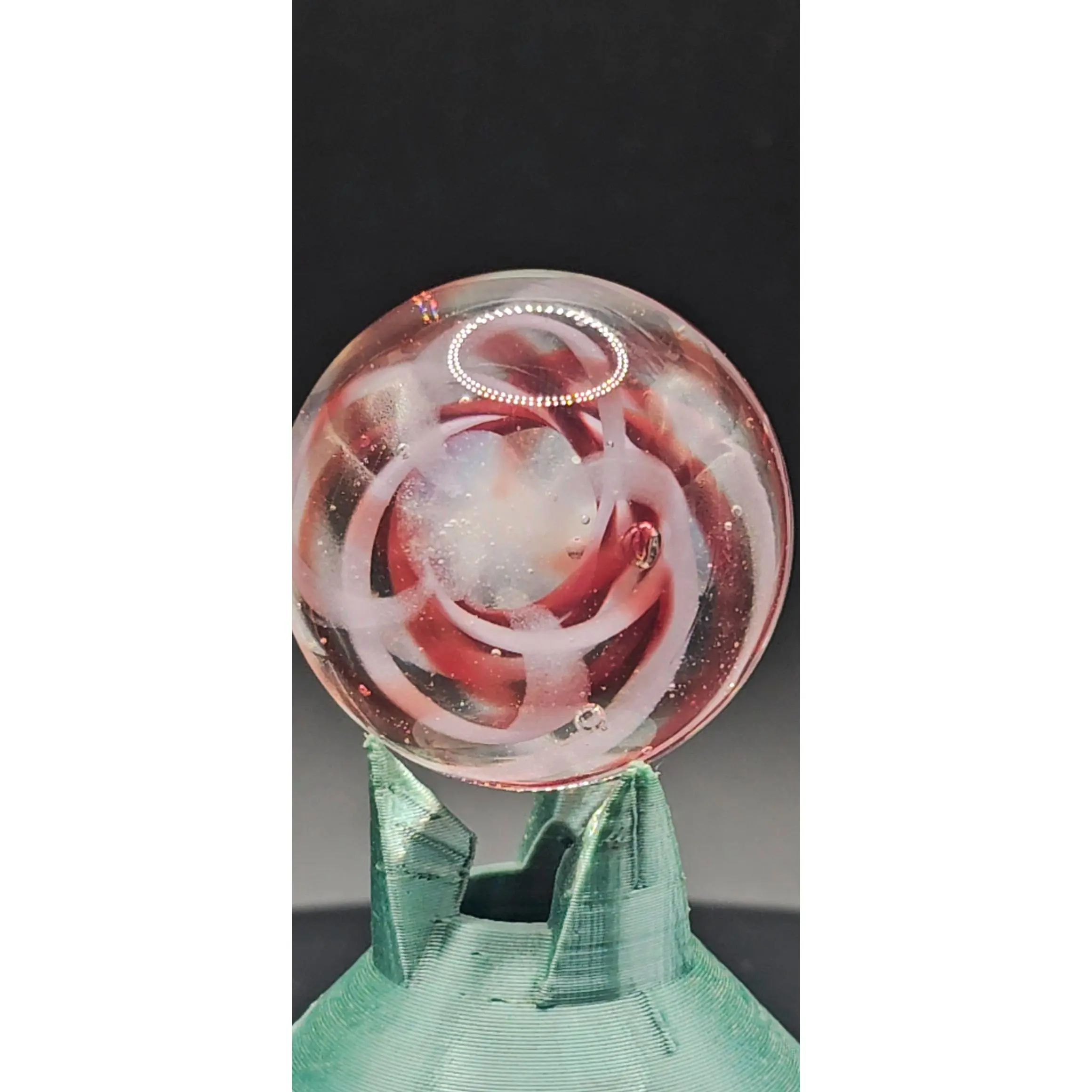 Essex Glass Infinity Loop — Materia of Continuance Handmade Borosilicate Glass Marble 1 Inch Diameter UV Reactive Pink Luminescence