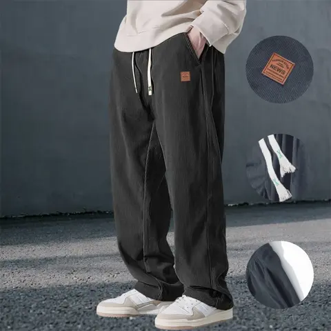Men’s casual loose-fit long pants with a retro street style, polyester fabric, drawstring design, and a relaxed drape—ideal for everyday wear in spring and autumn.