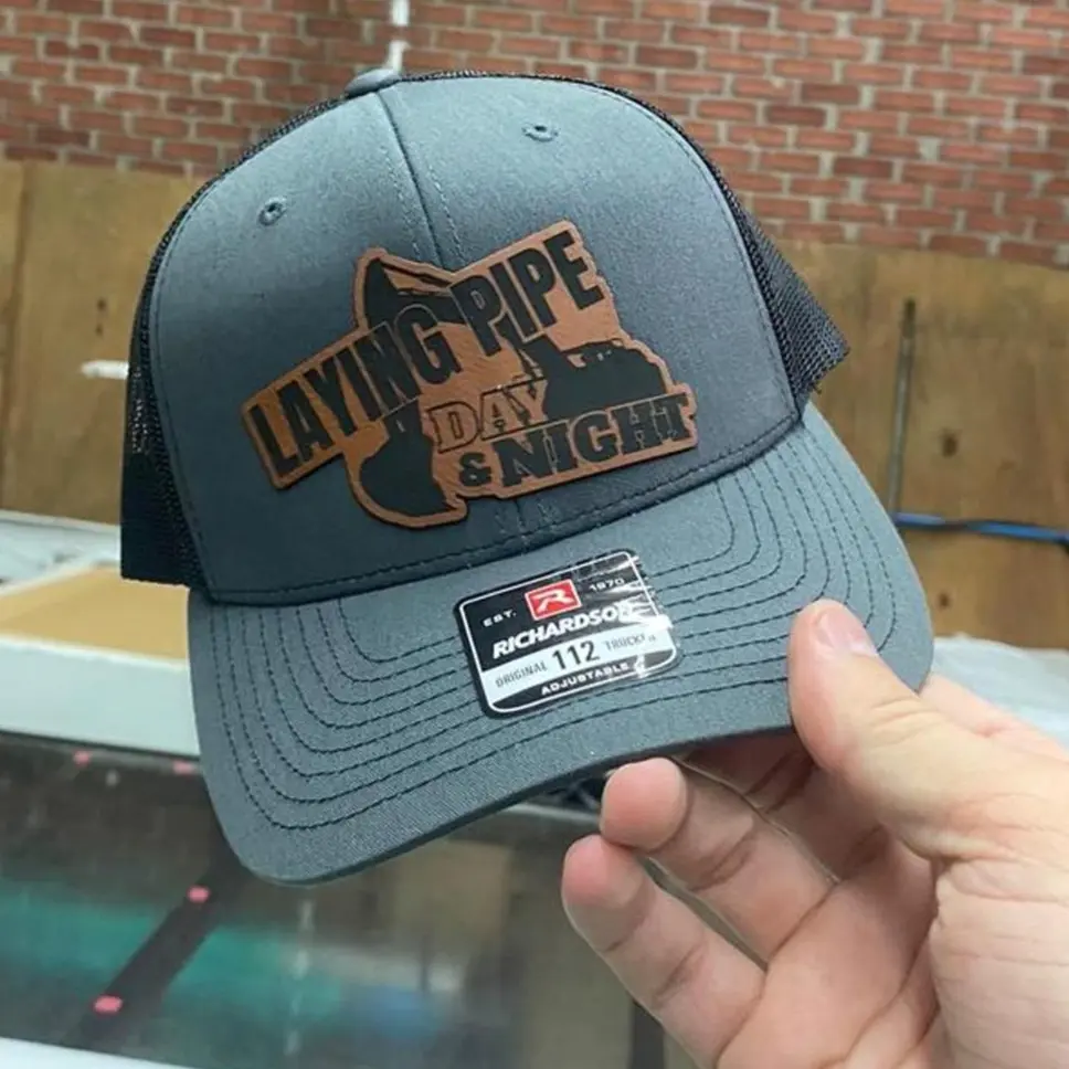 Laying pipe day and night tractor Trucker hat