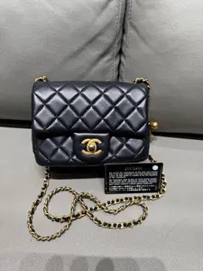Pre-owned CHANEL Mini Flap with adjustable gold ball.