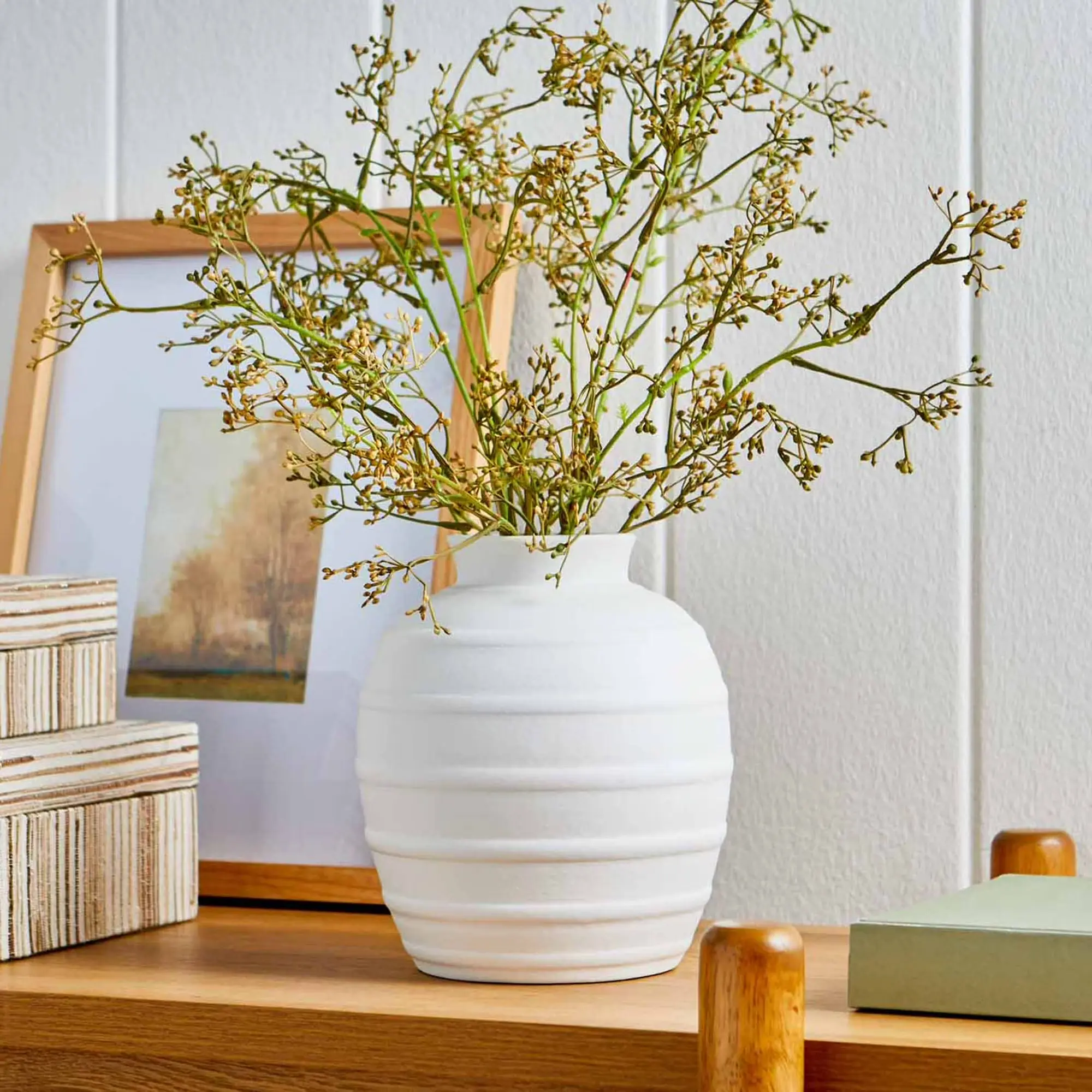 8-inch white ceramic vase with a vertical ribbed texture.