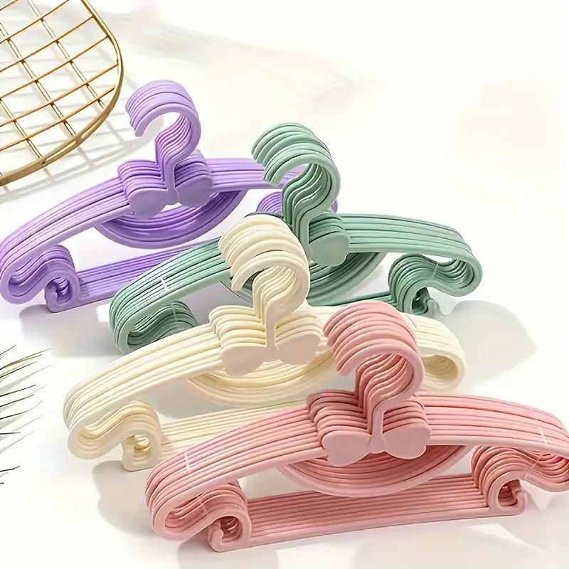 20-Pack Kids Clothes Hangers with Cute Bows - Durable, Expandable Plastic Hangers for Newborns, Toddlers & Children - Smooth Surface, Pastel Colors (Pink, Blue, White, Gray) - Perfect Holiday Gift for Organizing Baby Wardrobes, Baby Hangers for Clothes