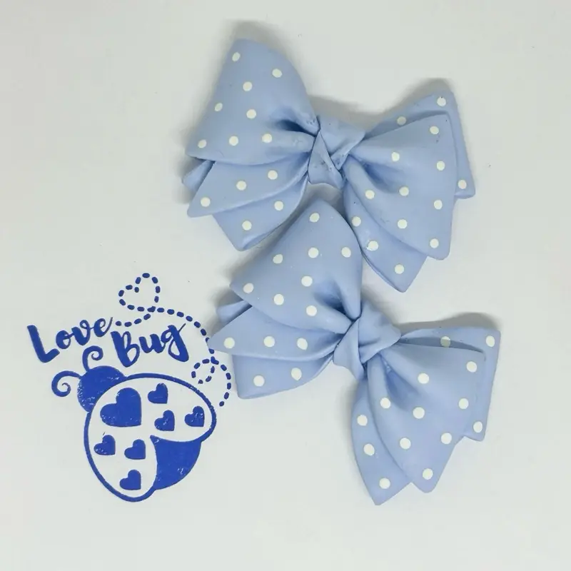 2inx2.5in clay flat back bows. Perfect embellishment for any badge reel, flat back beads or just the perfect decoration on for any DIY project you have.