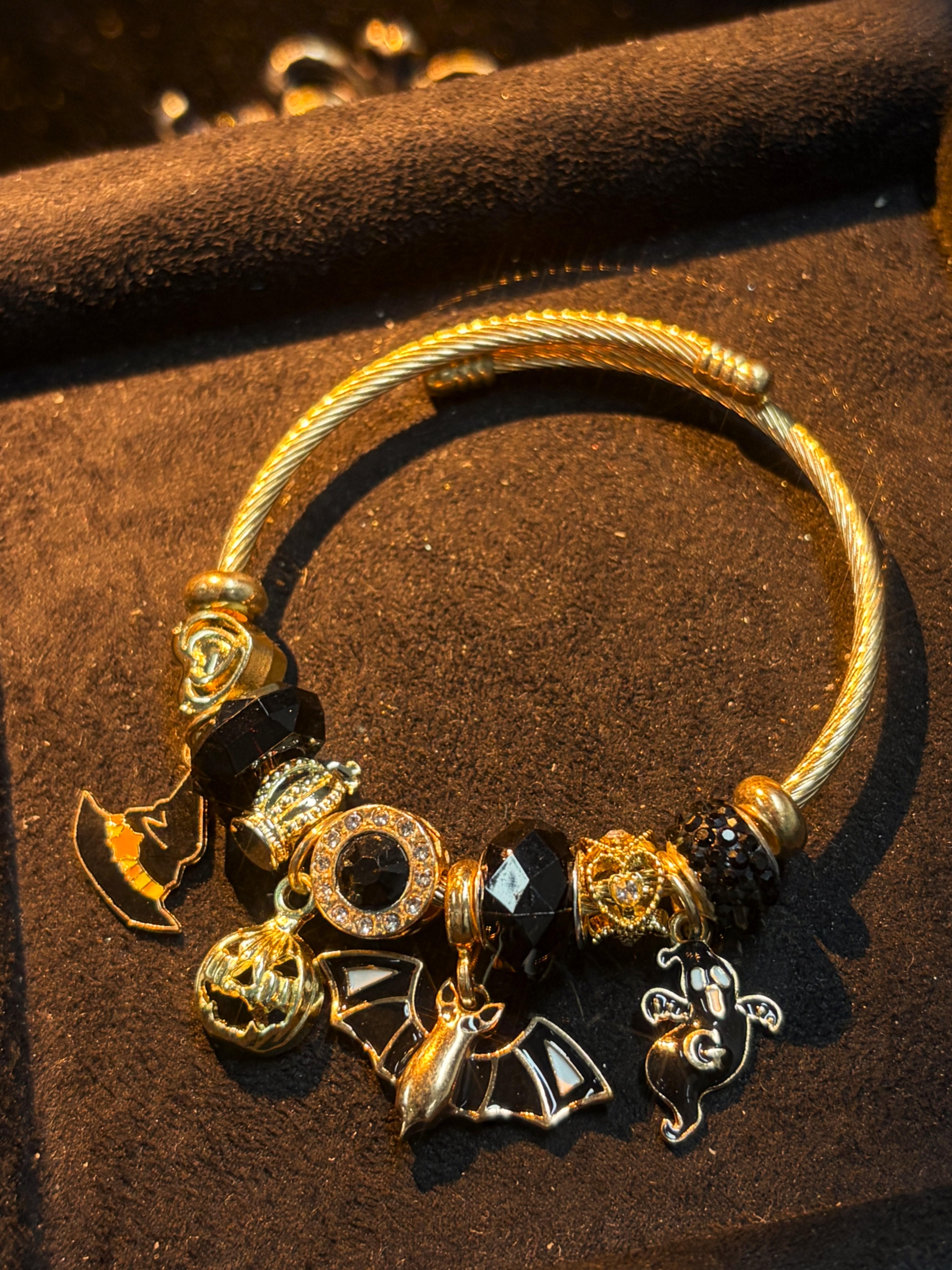 Women's Gold-Tone Open Cable Charm Bangle with Black Crystal Beads, Halloween Witch Hat Pumpkin Bat Ghost Charms, Stackable Costume Jewelry Bracelet