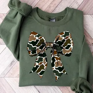 Camo Coquette Bow Sweatshirt, Green Round Neck Pullover with Camo Bow Detail, Soft Cotton Blend, Unisex Casual Fit for Women and Men, Aesthetic Cozy Fall Outfit, Trendy Gift Idea - AMBER