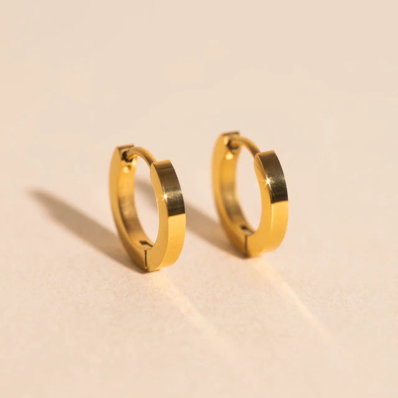 O.G. Smooth Huggie Hoop Earrings O.G. Smooth Huggie Hoop Earrings