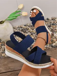 A pair of new large-size women's cross-strap, elastic-back slip-on wedge sandals for outdoor wear, stylish, simple, comfortable, suitable for daily commuting, with a thick sole