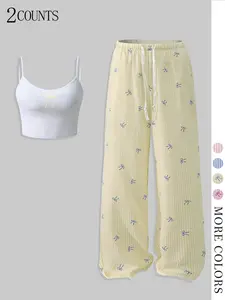 Cozy & Cute 2-Piece Loungewear Set: Soft Ribbed Pants + Bow-Accent Cami 🌸 Perfect for lazy days, sleepovers, or quick errands! Breathable fabric, stretchy waist, and mix-and-match vibes. Trendy pink stripes + sweet details Pajamas