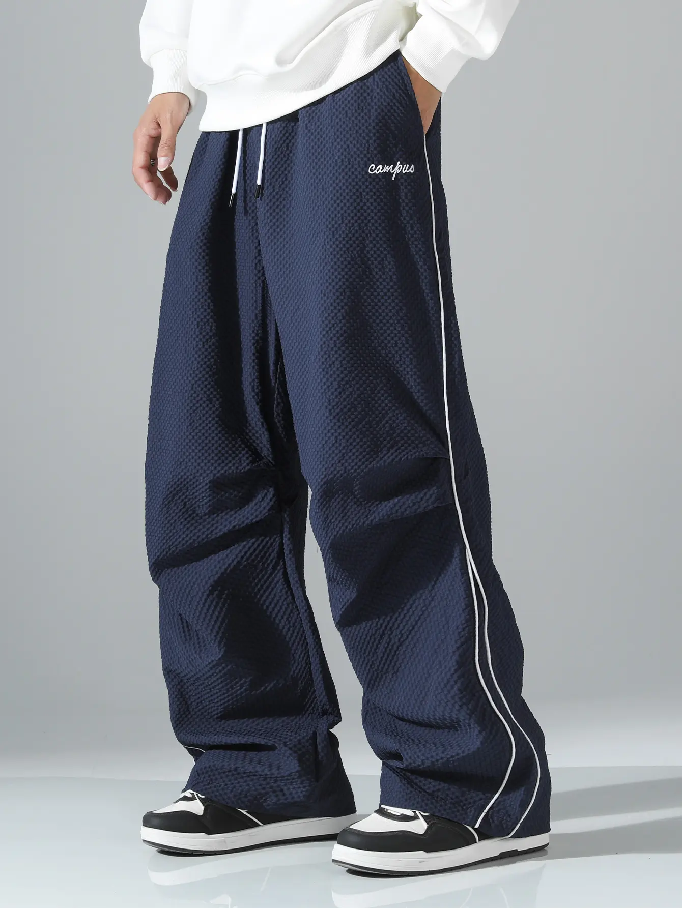 Summer loose men’s athletic pants, Bubble check fabric for pants lightweight soft fabric, oversized fit, gray side stripe with gold decorative stripe, comfortable design, casual sports bottoms for fitness wear, 100% polyester fiber