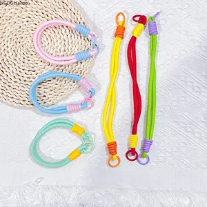 Cute Color-Block Paracord Lanyard — A playful, woven wrist strap featuring a striking contrast of mint green and bright yellow. Crafted from weather-resistant, non-slip material, it is an essential "hands-free" accessory for your phone, keys, or bag.