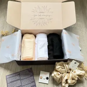 My first Hijab Box. Eid gift. Scarf. Undercaps. Magnets. Hair scrunchie. With Zamzam Water