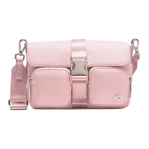 Lululemon Wunderlust 3L Nylon Crossbody Bag with Multiple Pockets and Detachable Strap for Women in Pink Mist