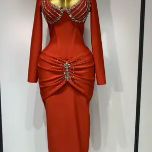Red Embellished Evening Dress with Sparkling Bead Detailing and Long Sleeves