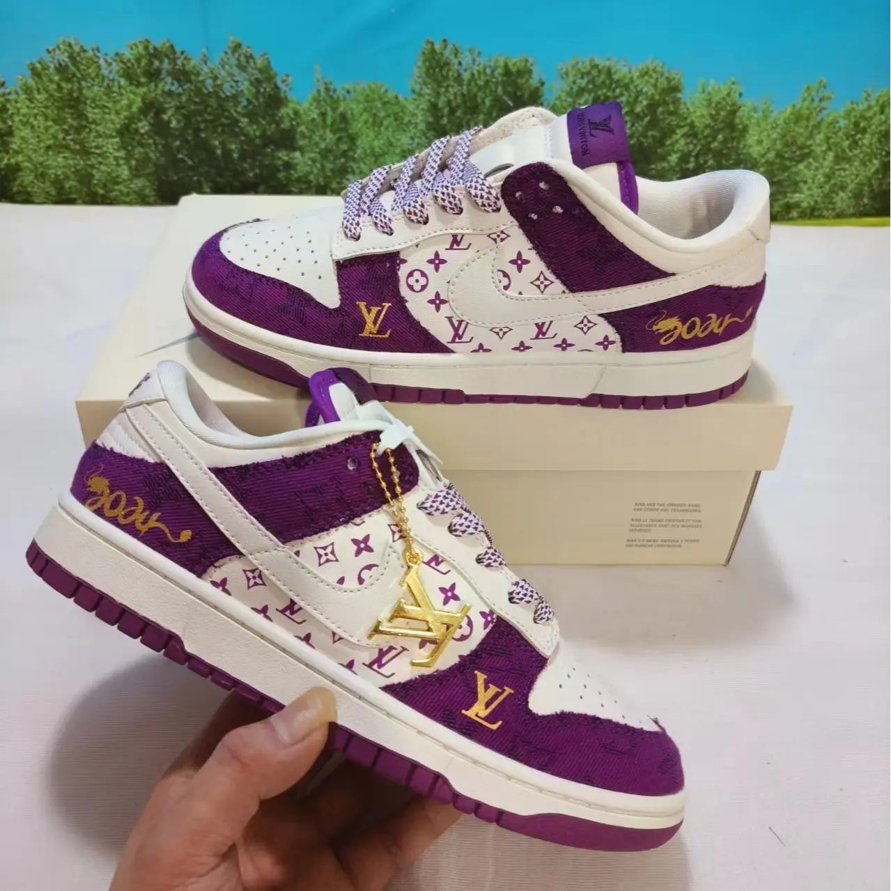 Retro skate sneakers with luxe romantic muted purple vintage silhouette, premium woven canvas & smooth leather in cream white base layered with deep violet monogram fabric & gold charm accents, matte purple rubber outsole